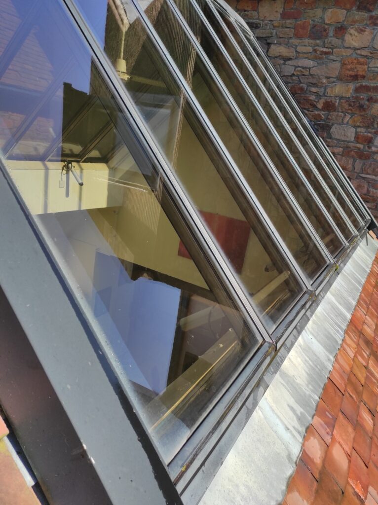 Sloping glass canopy clean